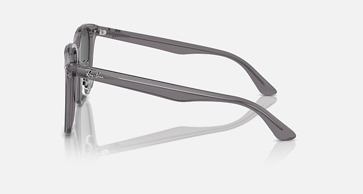 Sunglasses side view with dark lenses and gray-transparent temple arms