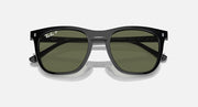 Black sunglasses with dark green lenses and silver center bridge connection