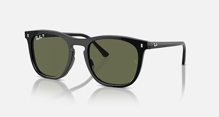 Black sunglasses with dark green lenses and glossy frame with thick front edges