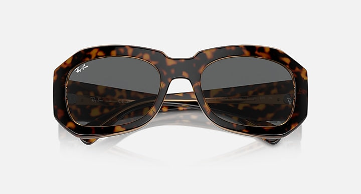 Tortoise brown sunglasses with dark lenses and sculpted bridge, front view