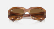 Brown sunglasses with dark amber gradient lenses, wide oval front view