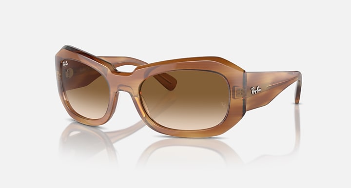 Brown square sunglasses with tan gradient lenses, translucent frame and slim temples