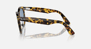 Wayfarer-style sunglasses with tortoiseshell frame, side profile, blue-tinted lenses