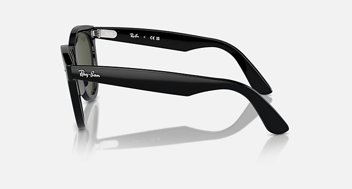 Wayfarer sunglasses with black frame, side profile and dark green lenses