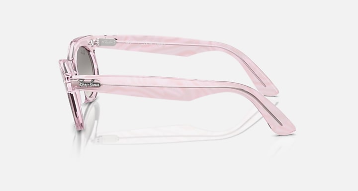 Wayfarer sunglasses in pink translucent frame, side view, low bridge fit