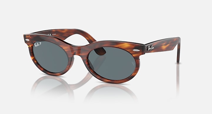 Wayfarer oval sunglasses angled left view, tortoise frame and dark gray lenses