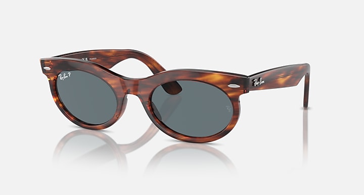 Ray-Ban tortoiseshell oval sunglasses with dark lenses, front-left view