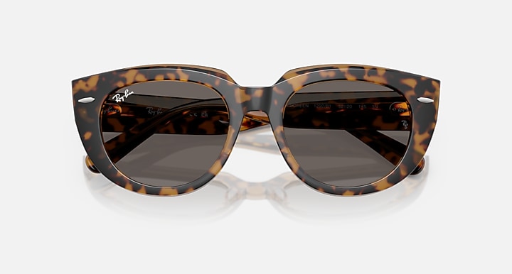 Tortoiseshell cat-eye sunglasses with dark gray lenses, glossy frame finish