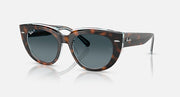 Cat-eye sunglasses with dark tortoiseshell frames and dark gray lenses, metal arms