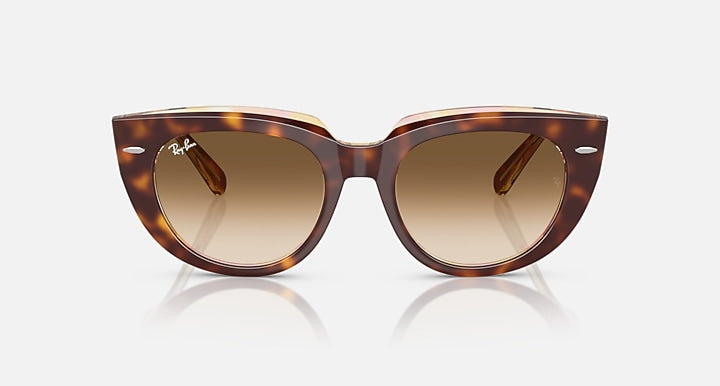 Ray-Ban cat-eye sunglasses, havana tortoise frame, warm brown gradient lenses.
