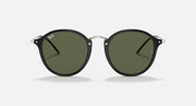Round black-frame sunglasses with dark green lenses, front view.