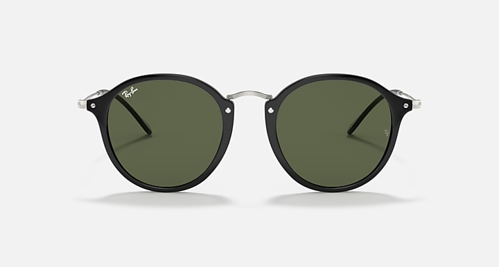 Round black-frame sunglasses with dark green lenses, front view.