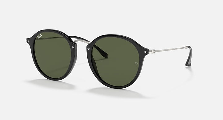 Round black sunglasses with dark green lenses and metal bridge, black temples.