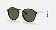 Round black sunglasses with dark green lenses and metal bridge, black temples.