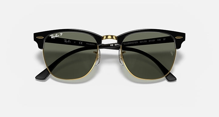 Ray-Ban Clubmaster sunglasses front view, black frame, gold-tone accents, dark mirrored lenses
