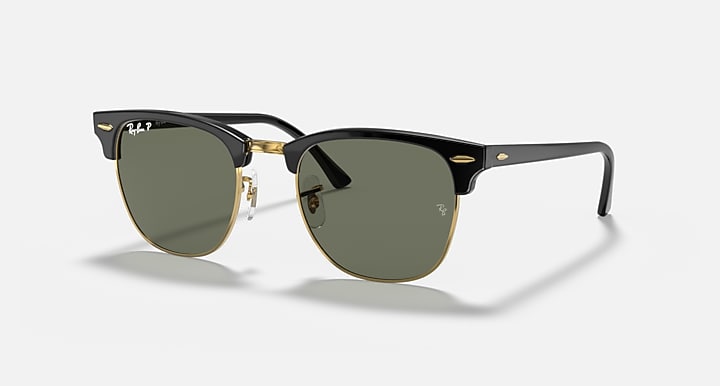 Ray-Ban Clubmaster sunglasses with dark lenses, black frame, and gold-tone details