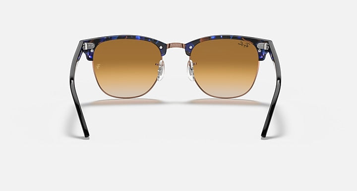 Ray-Ban Clubmaster sunglasses with blue acetate frame and light brown lenses