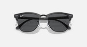 Black Clubmaster-style sunglasses with dark lenses and centered bridge