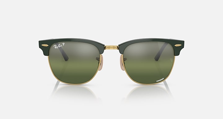 Green Clubmaster-style sunglasses with olive-tinted lenses and gold-tone trim