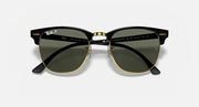 Clubmaster-style sunglasses front view; dark green lenses, black frame, gold metal bridge