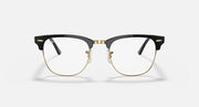Clubmaster-style sunglasses with black frame, clear lenses, and gold-tone bridge detail