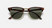 Clubmaster sunglasses with red-brown tortoise frame and green tinted lenses