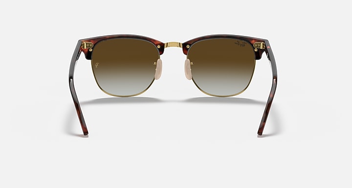 Clubmaster-style sunglasses with tortoiseshell frame and warm brown gradient lenses