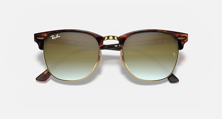 Clubmaster-style sunglasses with tortoiseshell frame and olive gradient lenses