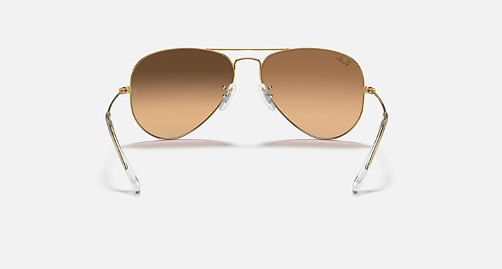 Aviator sunglasses with gold frame and light brown tinted lenses