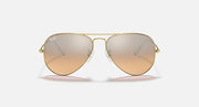 Aviator sunglasses with gold frame and light amber gradient lenses
