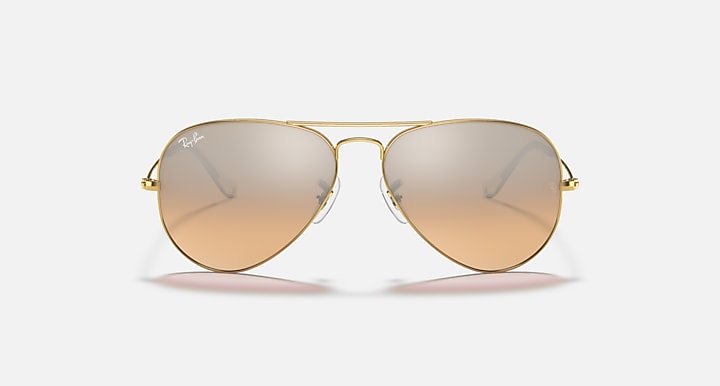 Aviator sunglasses with gold frame and light amber gradient lenses