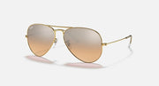 Aviator sunglasses with gold frame and light gradient lenses