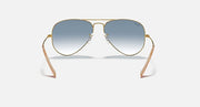 Ray-Ban Aviator sunglasses with metal frame and light blue gradient lenses