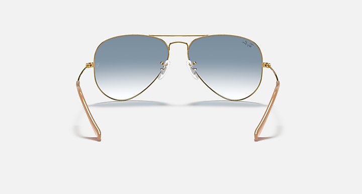 Ray-Ban Aviator sunglasses with metal frame and light blue gradient lenses