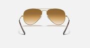 Ray-Ban Aviator sunglasses with metal frame and light gold-brown gradient lenses