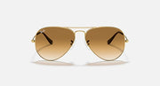 Ray-Ban aviator sunglasses with gold frame and amber tinted lenses