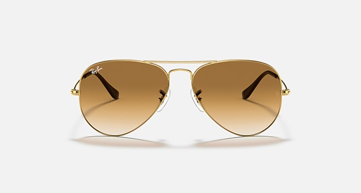 Ray-Ban aviator sunglasses with gold frame and amber tinted lenses