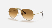 Ray-Ban aviator sunglasses with gold frame and light amber gradient lenses