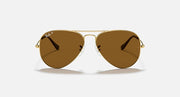Aviator sunglasses with gold frame and brown gradient lenses
