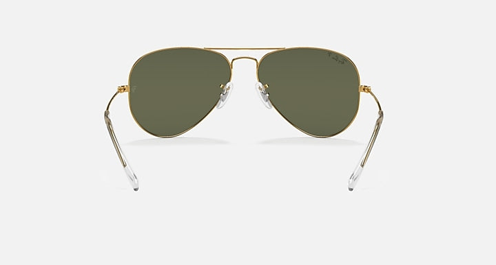Ray-Ban aviator sunglasses with thin metal frame and muted green tinted lenses.
