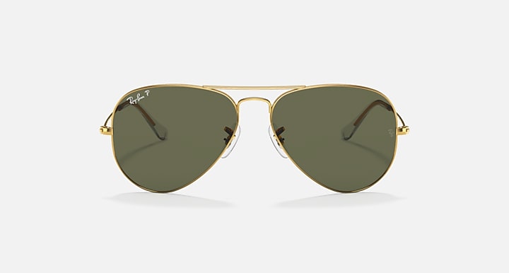 Gold aviator sunglasses with olive green tinted lenses and metal bridge