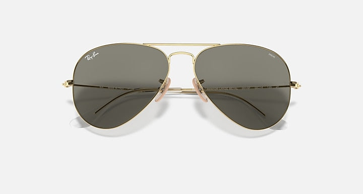 Ray-Ban aviator sunglasses, gold frame with dark gradient lenses, front view