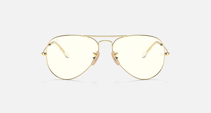 Aviator sunglasses with light gold frame and clear tinted lenses