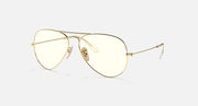 Ray-Ban aviator sunglasses with light gold frame and clear lenses