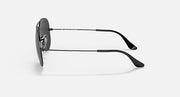 Ray-Ban aviator sunglasses with dark frame and green-tinted lenses, angled view