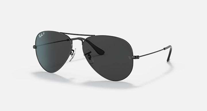 Ray-Ban aviator sunglasses with dark frame and deep gray-green tinted lenses