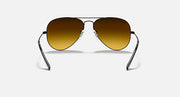 Ray-Ban Aviator sunglasses with metal frame and amber/gold gradient lenses
