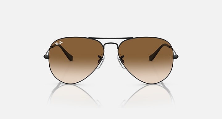 Ray-Ban aviator sunglasses with dark gold frame and brown tinted lenses