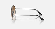 Ray-Ban aviator sunglasses in profile: green lens, silver frame, black temples