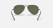 Aviator sunglasses with gold frame and deep green tinted lenses